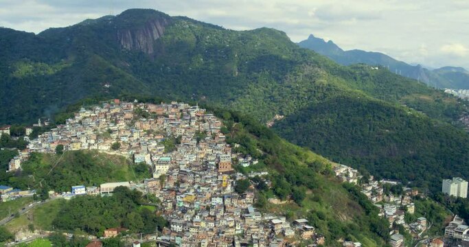 Incredible aerial view of the Morro dos Prazeres favela in Rio de Janeiro, Brazil. Wide shot, pull back.