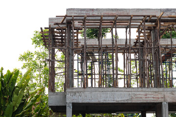 Scaffolding with the construction of a rural building.