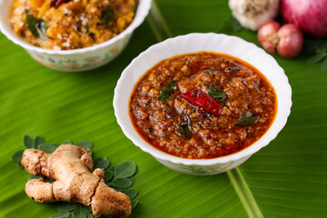 Injipuli , Puli Inji curry ginger pickle for Onam Sadhya Vishu vegetarian food on banana leaf. sweet and sour pickle made of ginger, tamarind,  jaggery in Tamil Nadu, Kerala South India , Sri Lanka.