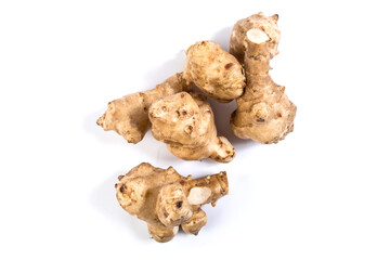 Roots of Jerusalem artichokes. Tubers of Jerusalem artichokes isolated on white.