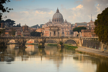 View of St. Peter's Basilica, Vatican City, Holy See, from a bridge over the Tiber river, Rome,...
