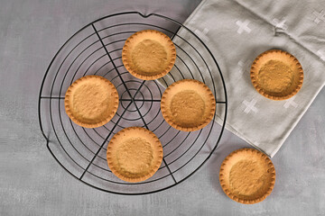 Top view of homemade small tartlet pastry crusts without filling