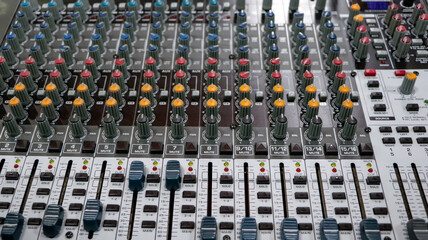 Sound mixer with continuous colored adjustment buttons and loudspeaker adjustments