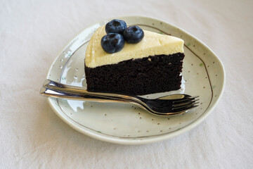 Dark beer cake in white plate