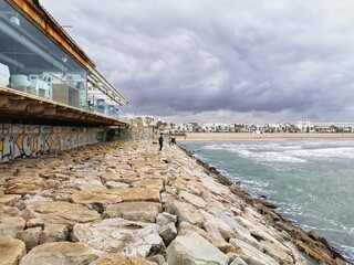 Stone Breakwater in the beach of Valencia, Spain
