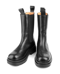 Women's shoes on a white background. Close up of a women's black leather chelsea boots on white background. Footwear for city, urban lifestyle or traveling. Concept of fashion, design and footwear.
