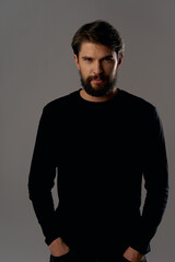 bearded man in black sweater elegant style fashion serious look
