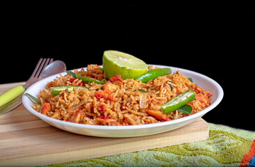 Fried rice with chicken. Prepared and served in the Natural wood background. Top view.