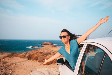 Young woman on vacation travel by car.