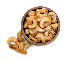 Roasted cashew nuts in wooden bowl isolated on white background