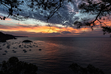 Sunrise on the bay of Tossa de mar, Spain, rising of the sun on the beach in Costa Brava