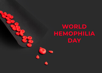 World hemophilia day concept. Red blood cells and blood drops are made of plasticine clay on a...