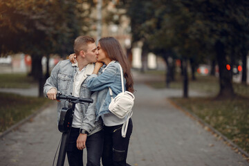 Fototapeta premium Beautiful couple spend time in a autumn city