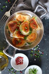 Homemade fried ravioli. Fried polish potato pierogis. Top view with copy space. Vegetarian and vegan food.