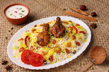 Chicken biryani Spicy Indian Malabar biryani Hyderabadi biryani, Dum Biriyani pulao golden bowl Kerala India Sri Lanka Pakistan basmati rice mixed rice dish with meat curry Ramadan Kareem, Eid