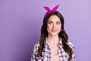 Photo portrait of dreamy girl looking at blank space isolated on vivid purple colored background