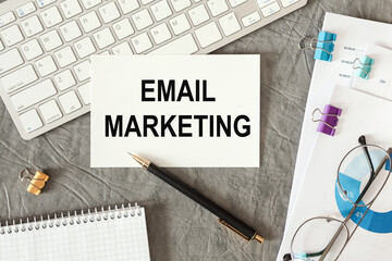 Email Marketing is written in a document on the office desk