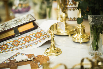 Naklejka na ściany i meble Golden crowns lying on the table in church