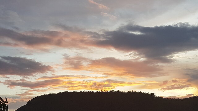 Beautiful Amber Sunset Sky over Mountain