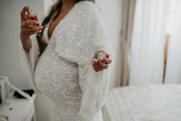 Fototapeta na wymiar pregnant bride on her wedding day expecting baby