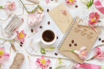 Coffee and sugar on a white table between pink flowers