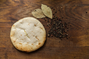Cheese and potato pie fresh from the oven. Potato pie on table