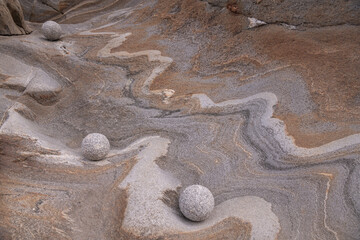Fototapeta na wymiar protected stone balls with beautiful textures in old granite stone.