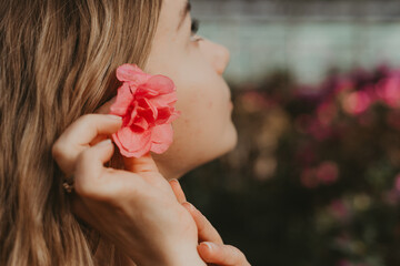 girl with flowers in her hair in the garden