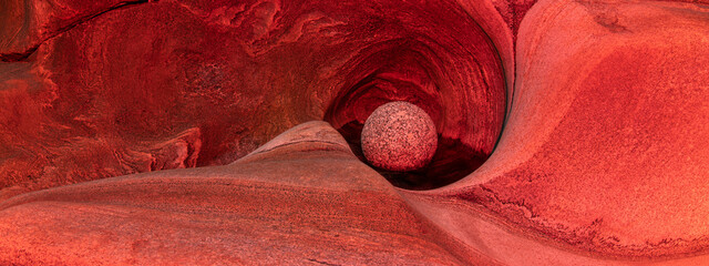 Protected stone ball in natural glacial mill with beautiful textures in old granite stone. Spa and wellness concept. © emotionpicture