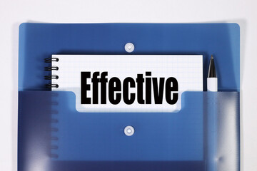 Effective. TEXT ON WHITE PAPER ON BLUE FOLDER