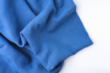 Blue cotton fabric smooth texture on white background.