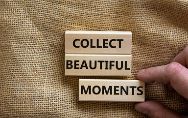 Collect beautiful moments symbol. Wooden blocks with words 'Collect beautiful moments'. Beautiful canvas background, businessman hand. Business, collect beautiful moments concept, copy space.