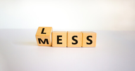 Less mess symbol. Turned the cube and changed the word 'mess' to 'less'. Beautiful white table,...