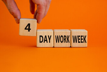 4 day work week symbol. Businessman holds the cube with words '4 day work week'. Beautiful orange...