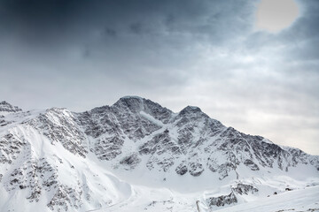 Obraz premium Glacier in the form of the number 7 on a mountain peak. North Caucasus, Kabardino-Balkaria, Elbrus, Russia.