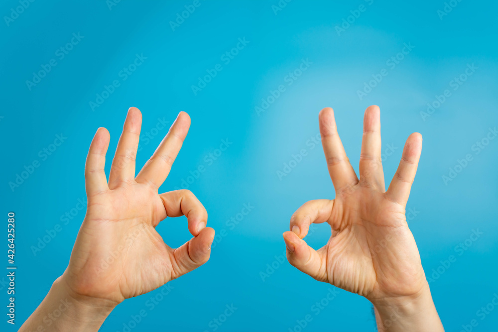 Wall mural gesture and body parts concept - man hands showing ok sign