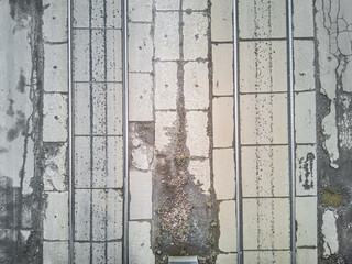 Old abandoned tram tracks in use, textured aerial view.