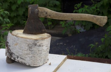 An axe prepared for chopping firewood in the country