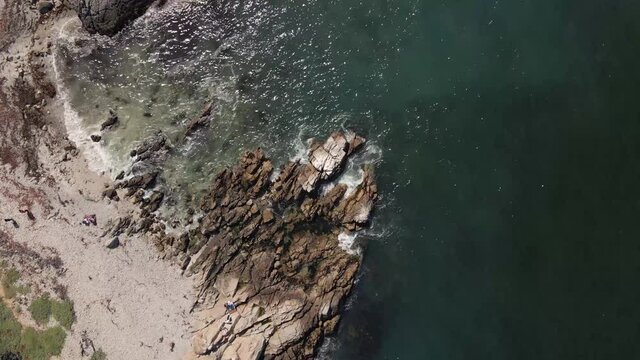 Overhead view at El Canelo Beach in Chile with waves crashing against the shore