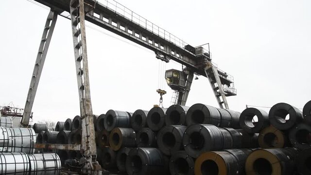 Port gantry crane moves cargo on the production site