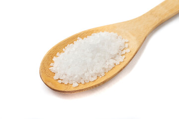 Fototapeta na wymiar Closeup of coarse salt on a wooden spoon isolated over white background
