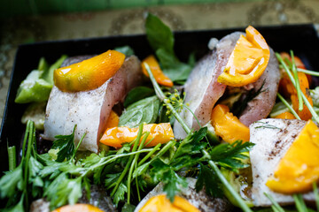 Homemade zander fish with vegetables and herbs