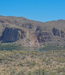 Beautiful desert rock formations line this secluded, Canyon Lake in Tortilla Flat, Tonto National Forest, Arizona