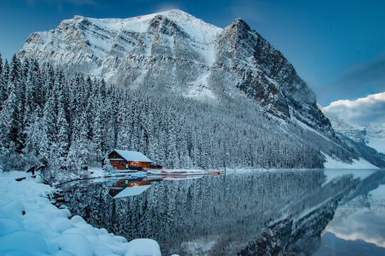 Lake Louise British Columbia during the winter with fresh snow on the surrounding mountains
