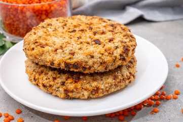 Healthy vegetarian or vegan food, meat free burger made from orange lentils legumes