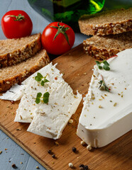 slices of feta cheese and whole grain bread on the table
