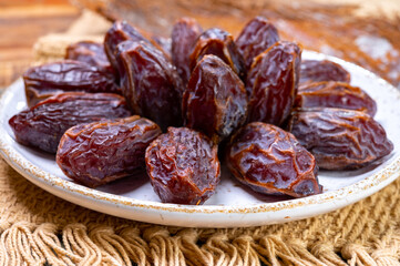 Fototapeta na wymiar Dried sweet sugar free dates medjoul fruits from Israel