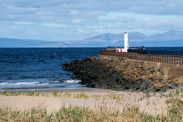 Isle of Arran Scotland from Ayr Beach with Harbour Light