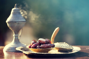 Ramadan kareem background with Quaran, censer and dates.