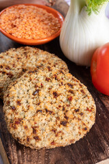 Tasty vegetarian food, burgers made from orange lentils legumes with sun dried tomatoes